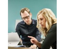 Two staff members collaborate at the Vista Projects engineering services office